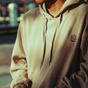 Person wearing a white hoodie